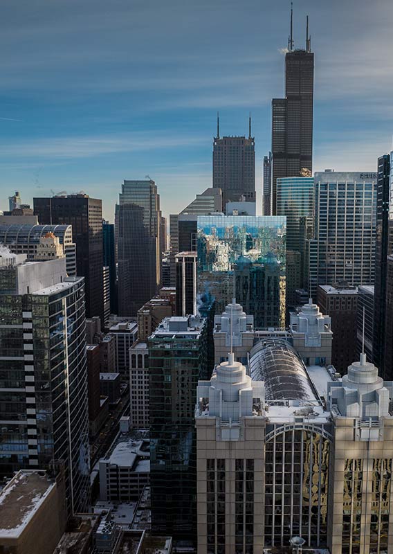 A view in a city skyline of tall skyscrapers.